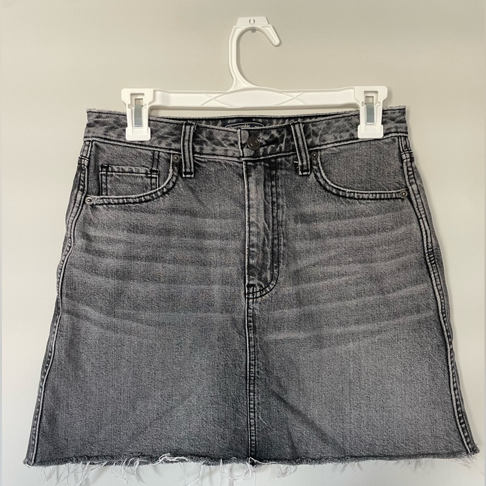 Abercrombie and Fitch black denim skirt. Size 26. Sits mid thigh